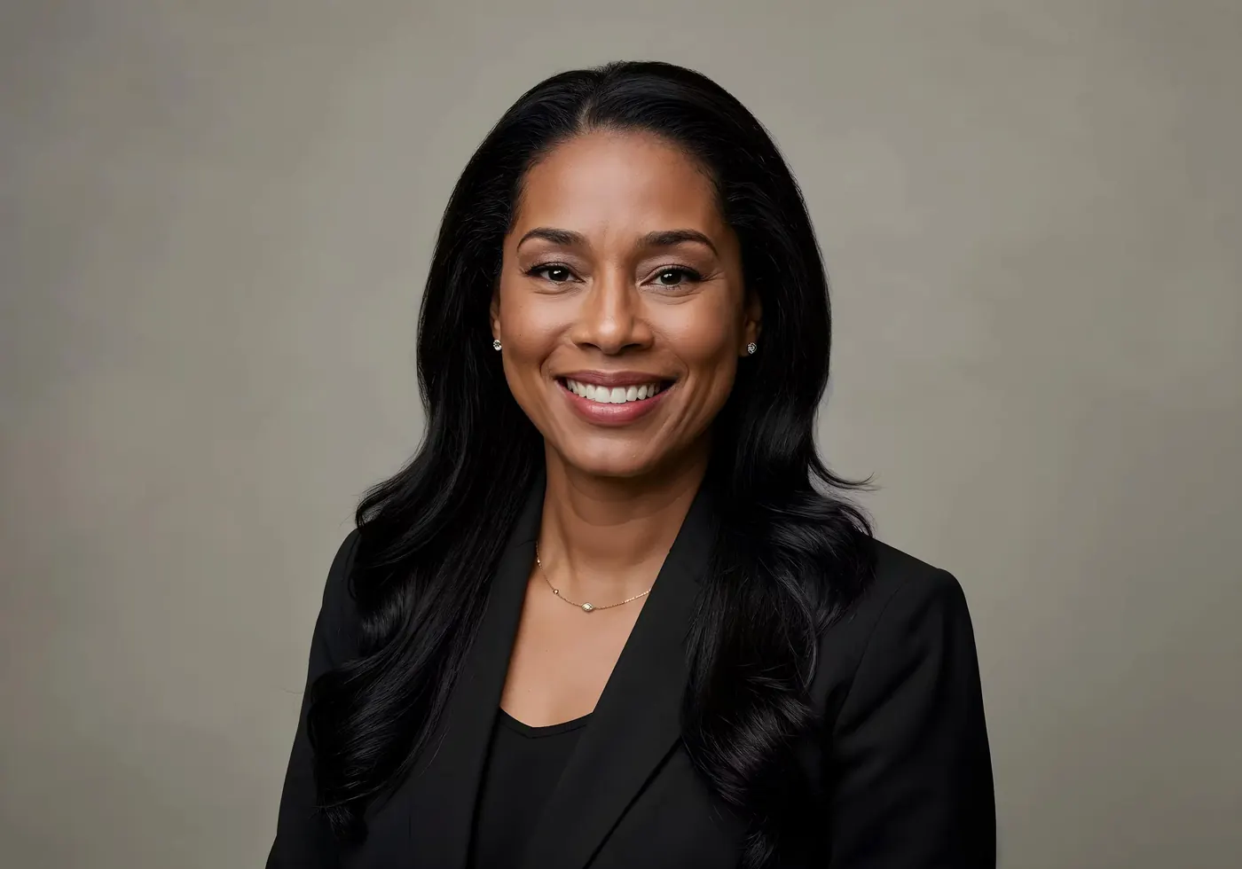 Smiling woman in a black blazer